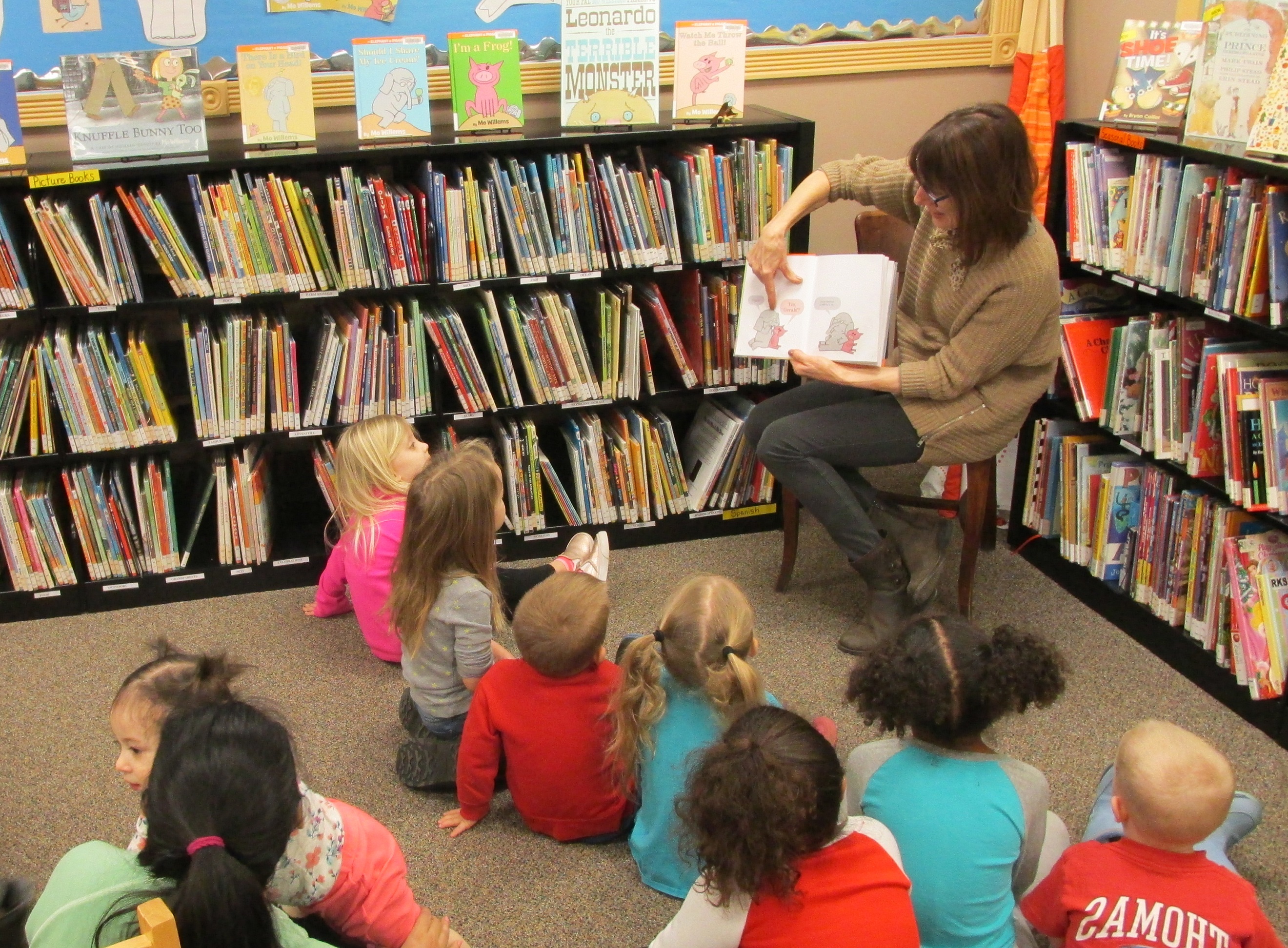 Kids listening to a story in the library