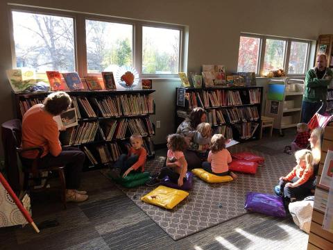 Children listening stories in the children's area